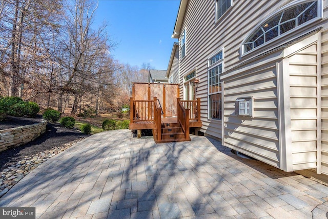 wooden deck with a patio area