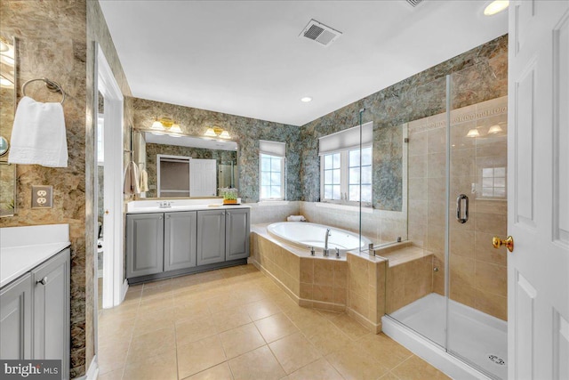 full bathroom with visible vents, a stall shower, vanity, a bath, and wallpapered walls