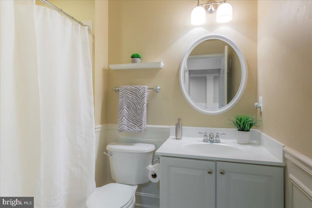 full bath featuring vanity and toilet