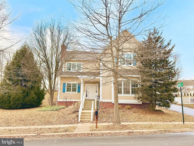 view of front of home with a chimney