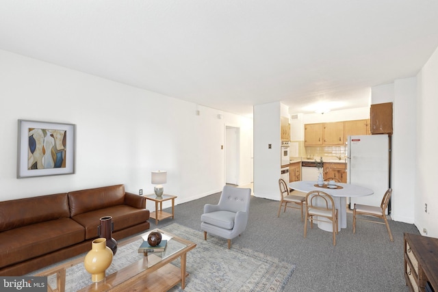 living room with dark colored carpet and baseboards