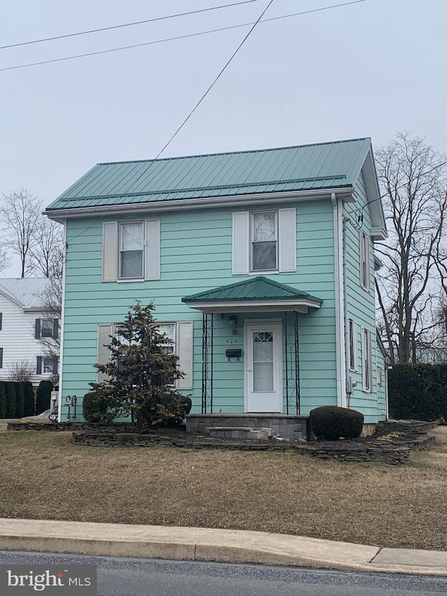 front facade featuring a front yard