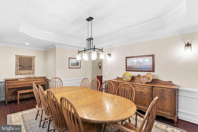 9801 Alydar Ct, Nokesville, VA 20181 - dining room featuring a raised ceiling, dark wood-type flooring, and wainscoting