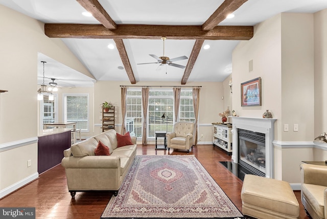 9801 Alydar Ct, Nokesville, VA 20181 - living area with a ceiling fan, baseboards, dark wood finished floors, vaulted ceiling with beams, and a fireplace with flush hearth