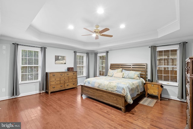 9801 Alydar Ct, Nokesville, VA 20181 - bedroom with baseboards, crown molding, a tray ceiling, and wood finished floors