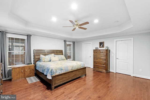 9801 Alydar Ct, Nokesville, VA 20181 - bedroom with a tray ceiling, multiple windows, and wood finished floors