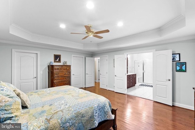 9801 Alydar Ct, Nokesville, VA 20181 - bedroom featuring baseboards, a raised ceiling, crown molding, and hardwood / wood-style flooring