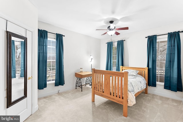 9801 Alydar Ct, Nokesville, VA 20181 - carpeted bedroom featuring baseboards, multiple windows, and ceiling fan