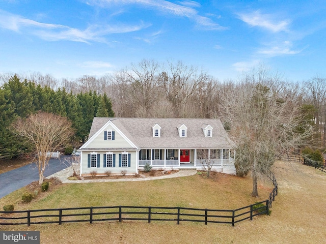 9801 Alydar Ct, Nokesville, VA 20181 - cape cod home with a fenced front yard, covered porch, a front lawn, and a shingled roof
