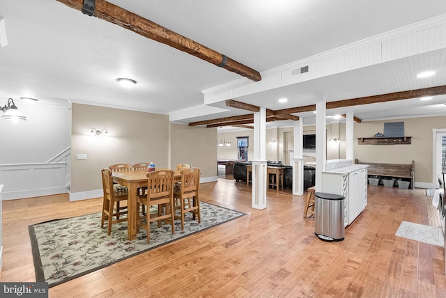 9801 Alydar Ct, Nokesville, VA 20181 - dining room with visible vents, baseboards, beam ceiling, crown molding, and light wood-type flooring