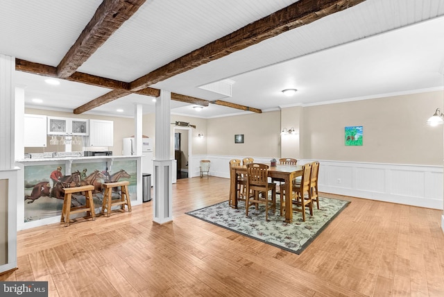 9801 Alydar Ct, Nokesville, VA 20181 - dining room with beam ceiling, a wainscoted wall, light wood-style floors, and ornamental molding