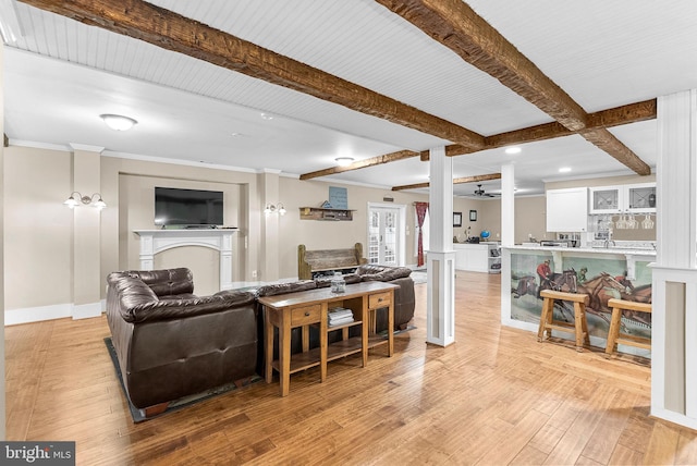 9801 Alydar Ct, Nokesville, VA 20181 - living area featuring ceiling fan, beam ceiling, light wood-style flooring, and a fireplace