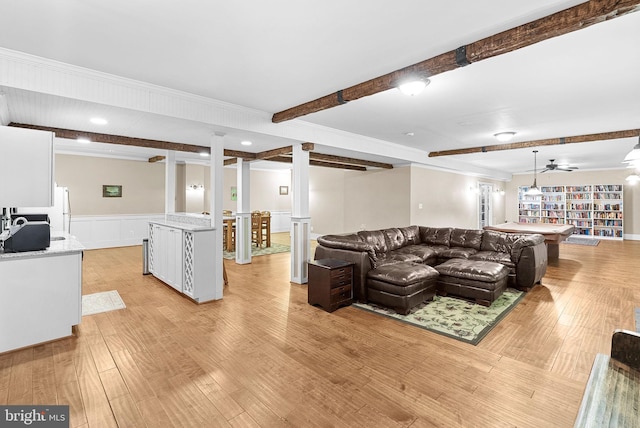 9801 Alydar Ct, Nokesville, VA 20181 - living room featuring light wood-type flooring, beamed ceiling, wainscoting, and a decorative wall