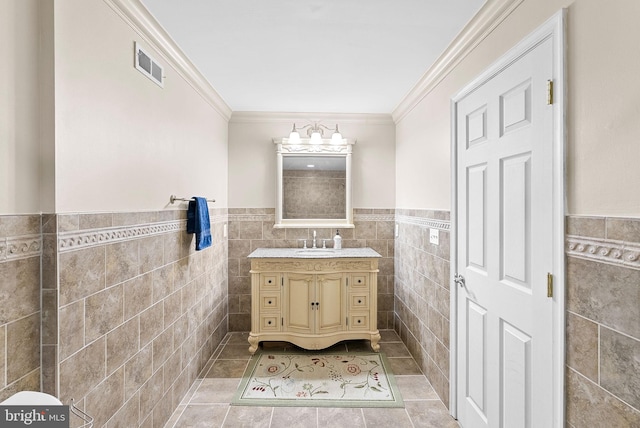 9801 Alydar Ct, Nokesville, VA 20181 - bathroom with visible vents, vanity, tile walls, and ornamental molding