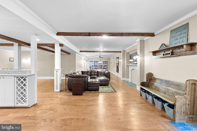 9801 Alydar Ct, Nokesville, VA 20181 - living room with crown molding, beamed ceiling, light wood-style floors, and ornate columns