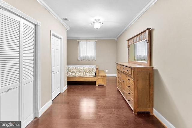 9801 Alydar Ct, Nokesville, VA 20181 - unfurnished bedroom featuring dark wood finished floors, baseboards, visible vents, and ornamental molding