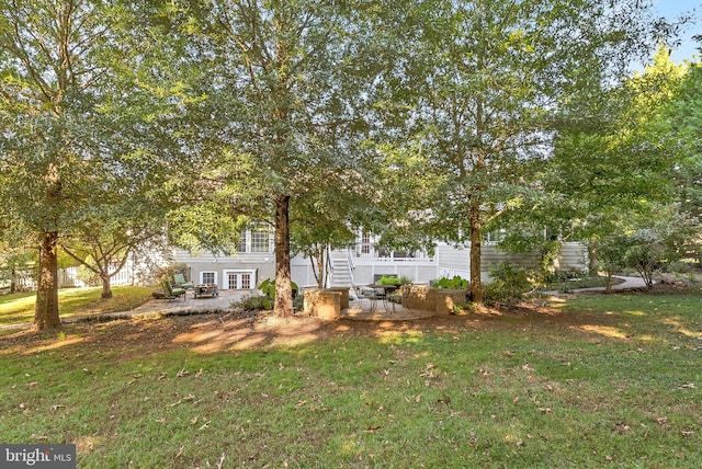 9801 Alydar Ct, Nokesville, VA 20181 - exterior space featuring a front yard and a patio area