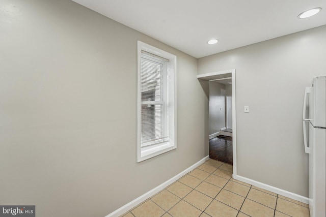 hallway with light tile patterned floors