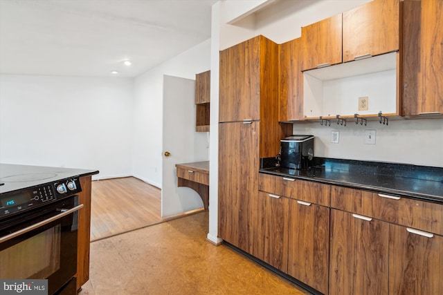 kitchen featuring modern cabinets, brown cabinets, black range with electric stovetop, light floors, and open shelves