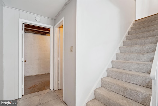 stairs featuring tile patterned floors