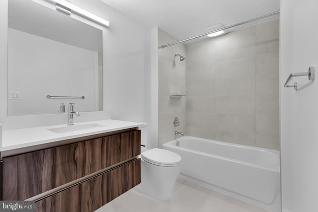 full bathroom with toilet, vanity, and tiled shower / bath