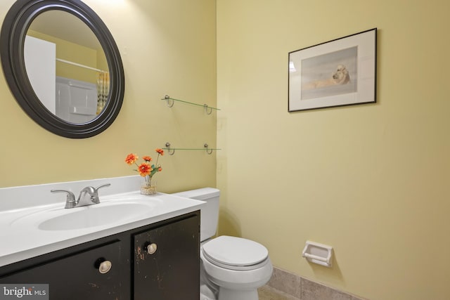 full bathroom featuring vanity and toilet