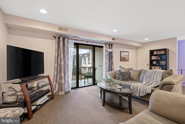 carpeted living room featuring visible vents and recessed lighting