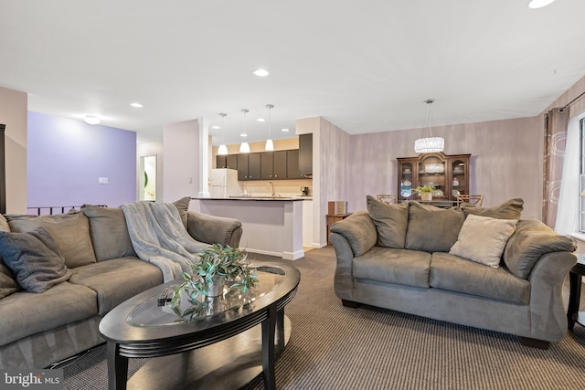 living area with carpet and recessed lighting