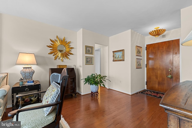 office area featuring baseboards and wood finished floors