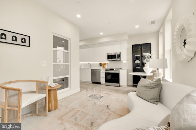 living room featuring light wood-type flooring