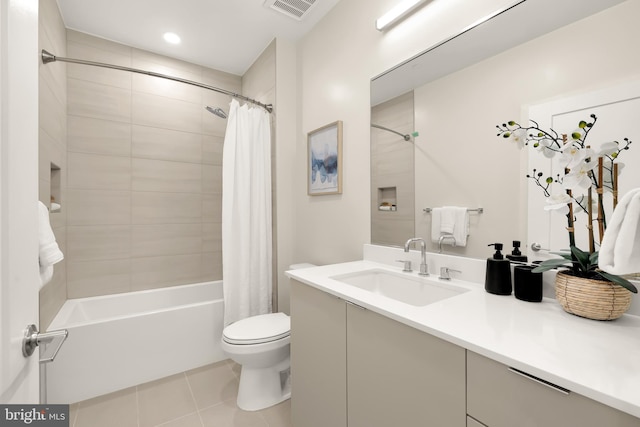 full bathroom with toilet, vanity, tile patterned flooring, and shower / bath combo with shower curtain