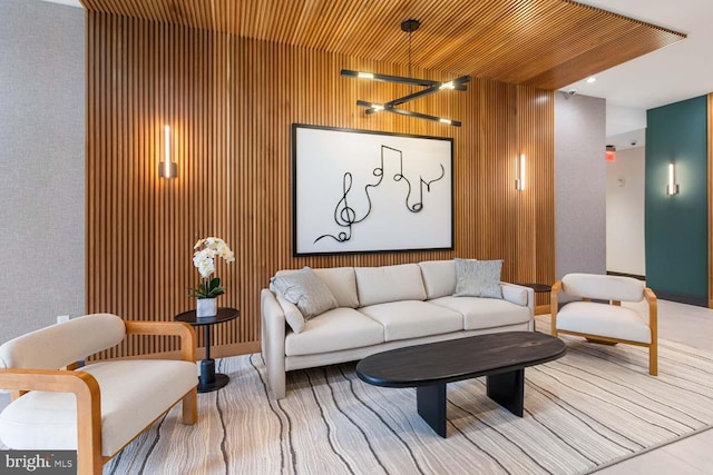 living room featuring wooden walls and wooden ceiling