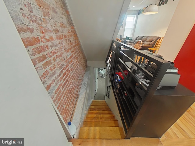 stairway with brick wall