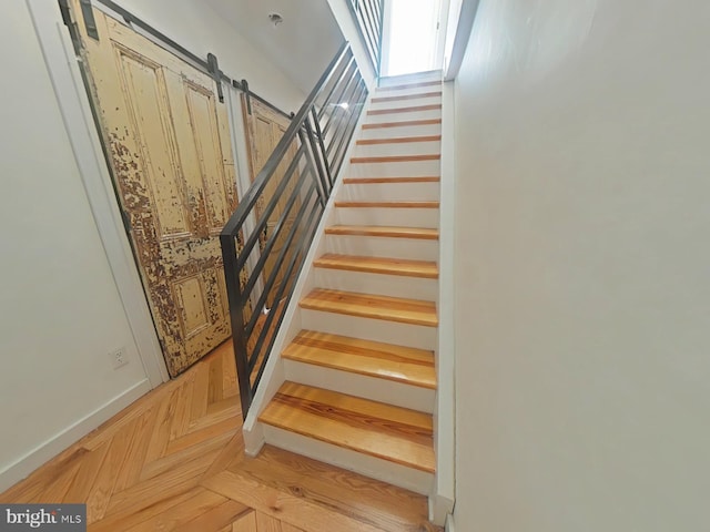 staircase featuring a skylight