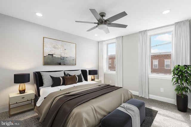 bedroom with light carpet, baseboards, a ceiling fan, and recessed lighting