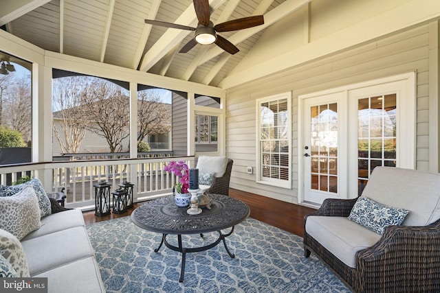 sunroom featuring wooden ceiling, a healthy amount of sunlight, ceiling fan, and lofted ceiling with beams