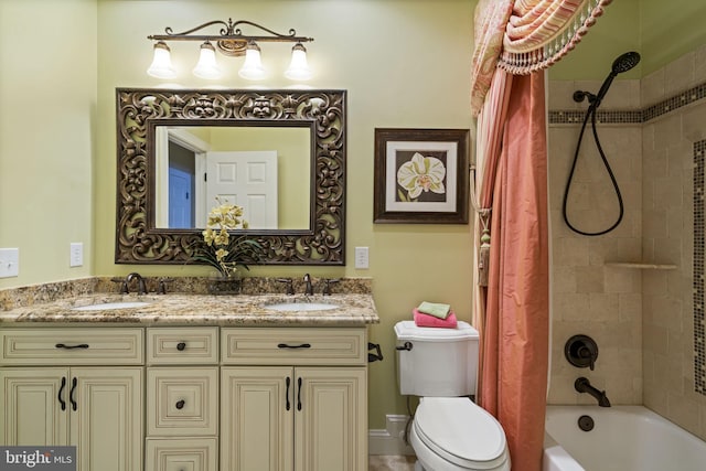 full bath with double vanity, shower / tub combo, a sink, and toilet