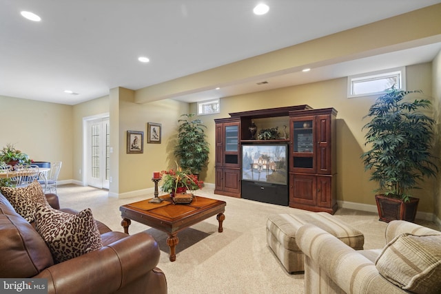 living room with light carpet, baseboards, and recessed lighting