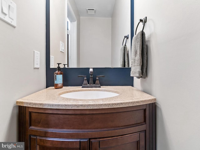 bathroom with visible vents and vanity