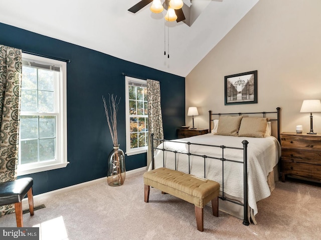 carpeted bedroom with baseboards, high vaulted ceiling, and ceiling fan