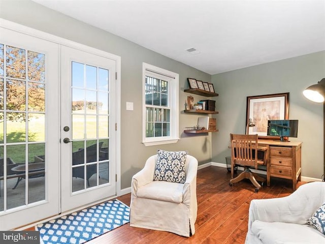 home office featuring french doors, baseboards, visible vents, and hardwood / wood-style floors