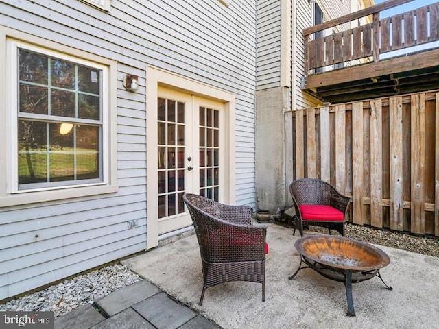 view of patio featuring french doors and an outdoor fire pit