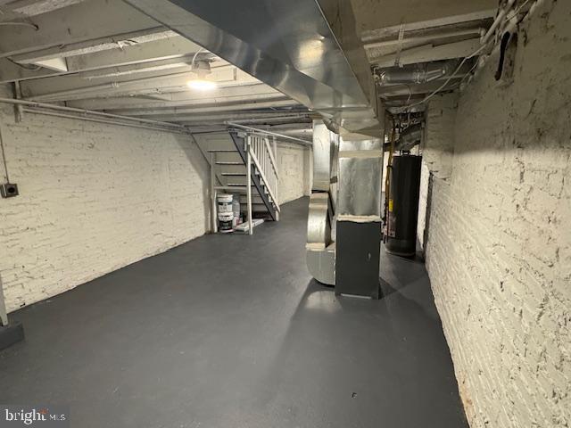 basement with heating unit and water heater