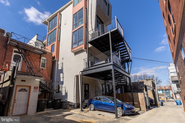 view of property featuring stairway