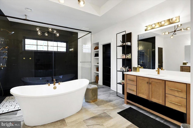 full bathroom with tiled shower, a soaking tub, a walk in closet, and vanity