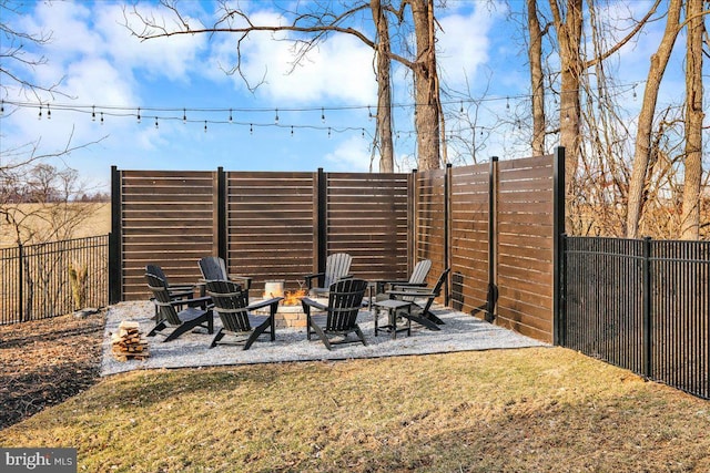 view of patio / terrace with an outdoor fire pit and fence