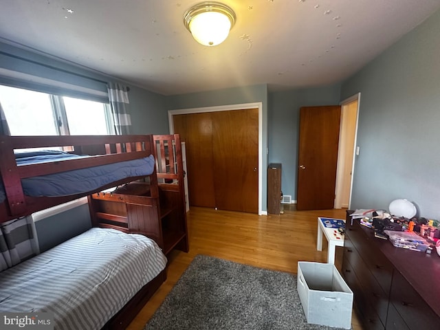 bedroom featuring a closet and wood finished floors