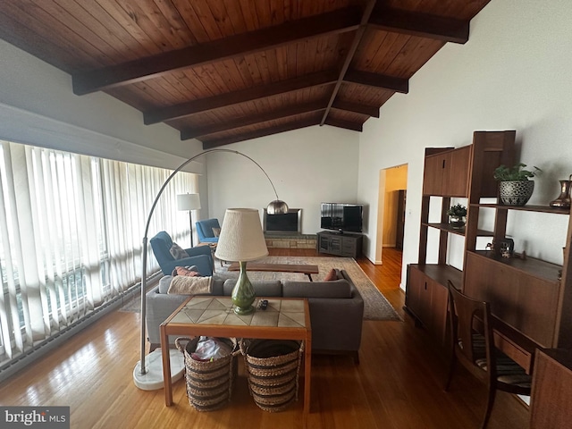 living room with vaulted ceiling with beams, wooden ceiling, and wood finished floors