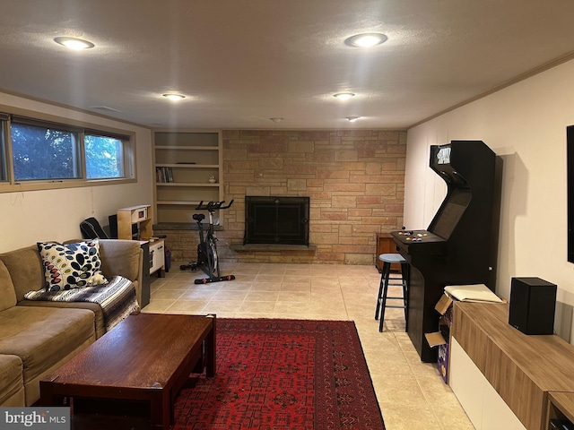 living room with a fireplace and light tile patterned floors