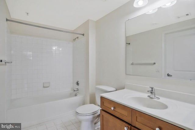 bathroom featuring visible vents, toilet, tile patterned floors, tub / shower combination, and vanity